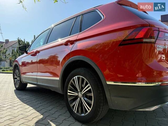Червоний Фольксваген Тігуан, об'ємом двигуна 2 л та пробігом 133 тис. км за 26400 $, фото 4 на Automoto.ua