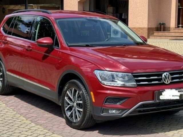 Красный Фольксваген Тигуан, объемом двигателя 2 л и пробегом 90 тыс. км за 367 $, фото 1 на Automoto.ua