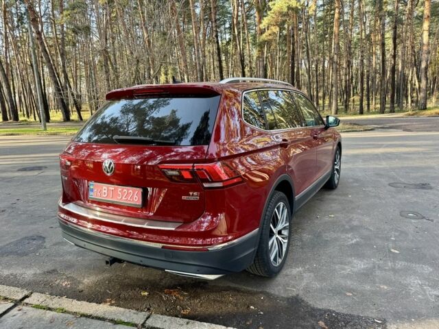Червоний Фольксваген Тігуан, об'ємом двигуна 2 л та пробігом 91 тис. км за 18900 $, фото 2 на Automoto.ua