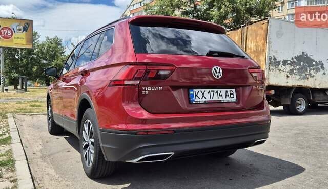 Червоний Фольксваген Тігуан, об'ємом двигуна 1.98 л та пробігом 110 тис. км за 21600 $, фото 1 на Automoto.ua