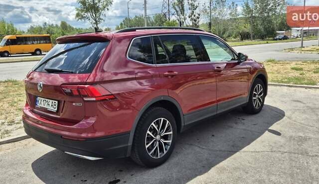 Червоний Фольксваген Тігуан, об'ємом двигуна 1.98 л та пробігом 110 тис. км за 21600 $, фото 4 на Automoto.ua