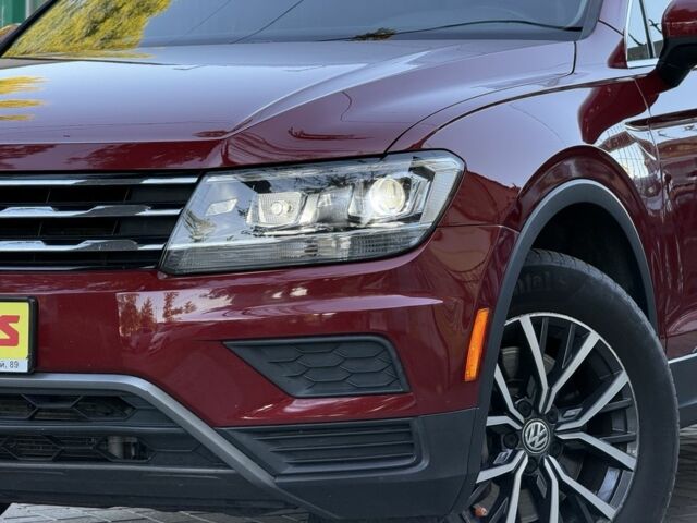 Червоний Фольксваген Тігуан, об'ємом двигуна 2 л та пробігом 99 тис. км за 20800 $, фото 2 на Automoto.ua