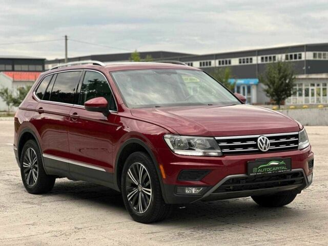 Красный Фольксваген Тигуан, объемом двигателя 2 л и пробегом 145 тыс. км за 20990 $, фото 1 на Automoto.ua
