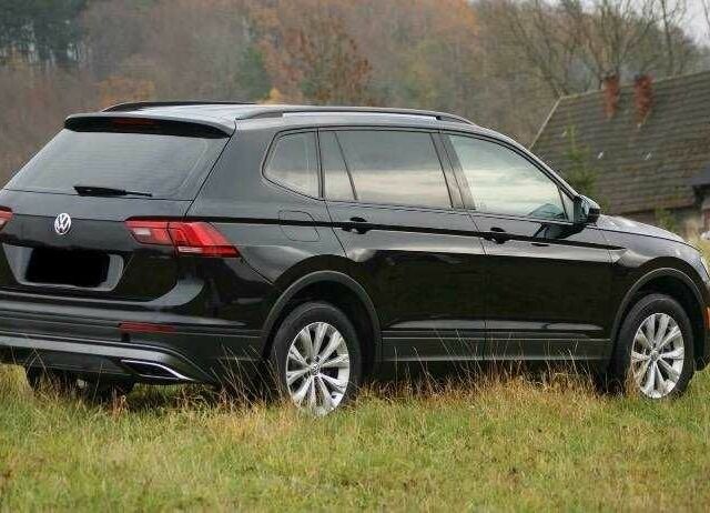 Красный Фольксваген Тигуан, объемом двигателя 2 л и пробегом 35 тыс. км за 13200 $, фото 3 на Automoto.ua