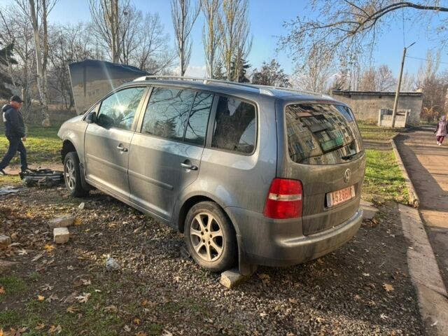 Серый Фольксваген Тигуан, объемом двигателя 2 л и пробегом 140 тыс. км за 1425 $, фото 2 на Automoto.ua