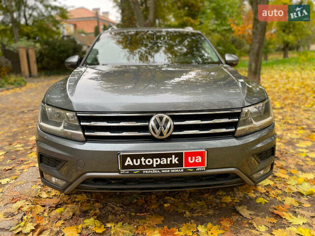 Серый Фольксваген Тигуан, объемом двигателя 2 л и пробегом 205 тыс. км за 16940 $, фото 1 на Automoto.ua