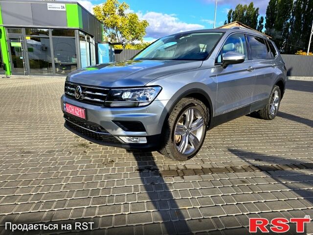 Сірий Фольксваген Тігуан, об'ємом двигуна 2 л та пробігом 147 тис. км за 21950 $, фото 4 на Automoto.ua