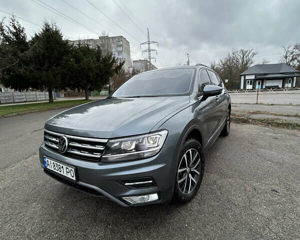 Сірий Фольксваген Тігуан, об'ємом двигуна 1.98 л та пробігом 128 тис. км за 18700 $, фото 1 на Automoto.ua