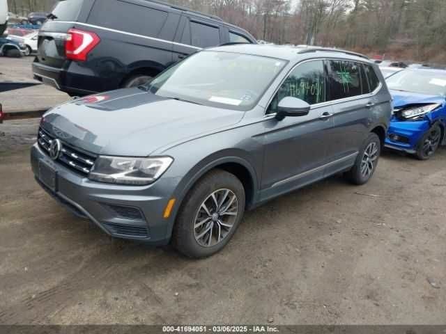 Серый Фольксваген Тигуан, объемом двигателя 2 л и пробегом 59 тыс. км за 4000 $, фото 1 на Automoto.ua