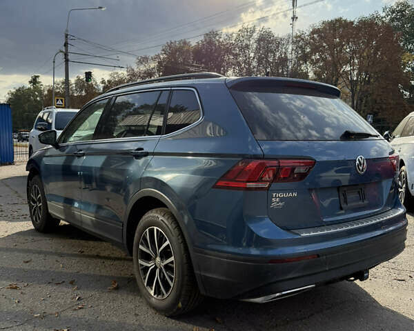 Синий Фольксваген Тигуан, объемом двигателя 2 л и пробегом 128 тыс. км за 18500 $, фото 1 на Automoto.ua