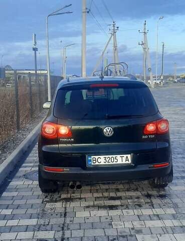 Зеленый Фольксваген Тигуан, объемом двигателя 2 л и пробегом 255 тыс. км за 10200 $, фото 1 на Automoto.ua