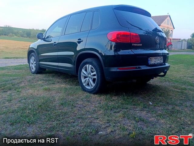Зелений Фольксваген Тігуан, об'ємом двигуна 2 л та пробігом 280 тис. км за 13700 $, фото 7 на Automoto.ua