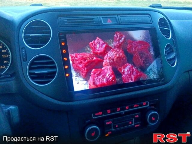 Зелений Фольксваген Тігуан, об'ємом двигуна 2 л та пробігом 280 тис. км за 13700 $, фото 1 на Automoto.ua