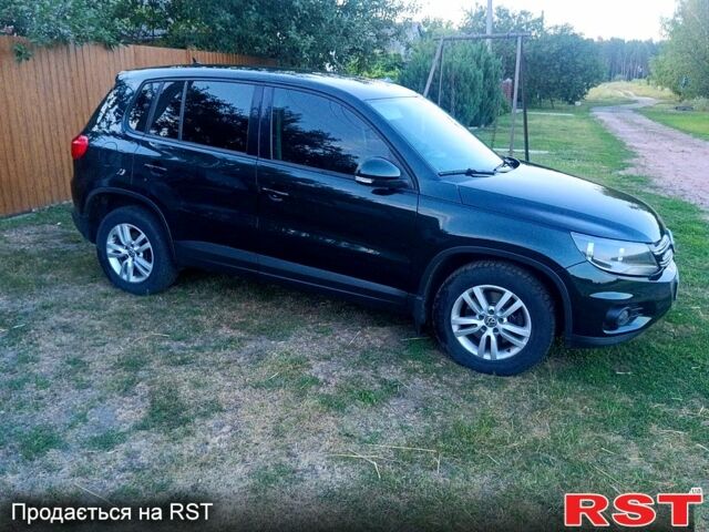 Зелений Фольксваген Тігуан, об'ємом двигуна 2 л та пробігом 280 тис. км за 13700 $, фото 4 на Automoto.ua