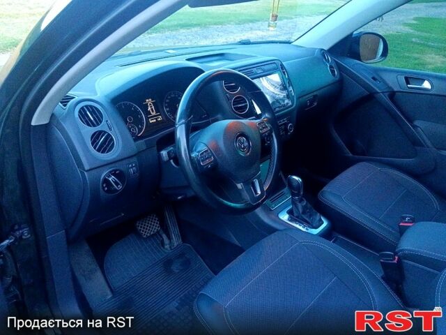 Зелений Фольксваген Тігуан, об'ємом двигуна 2 л та пробігом 280 тис. км за 13700 $, фото 5 на Automoto.ua