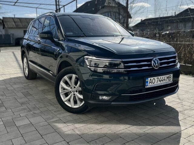 Зеленый Фольксваген Тигуан, объемом двигателя 2 л и пробегом 208 тыс. км за 30900 $, фото 1 на Automoto.ua