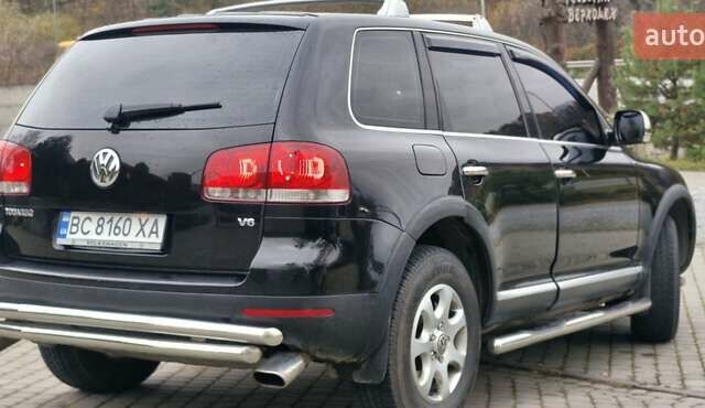 Черный Фольксваген Туарег, объемом двигателя 3.2 л и пробегом 237 тыс. км за 7500 $, фото 1 на Automoto.ua