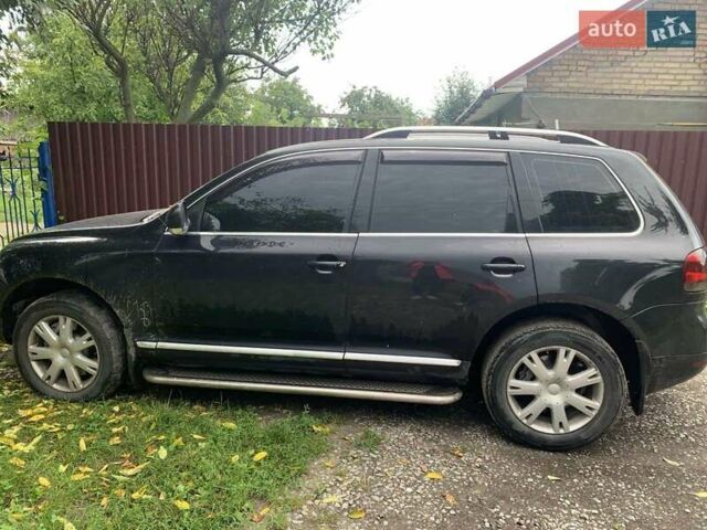 Черный Фольксваген Туарег, объемом двигателя 4.92 л и пробегом 354 тыс. км за 7000 $, фото 1 на Automoto.ua