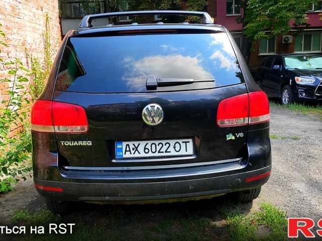 Черный Фольксваген Туарег, объемом двигателя 3.2 л и пробегом 430 тыс. км за 9500 $, фото 1 на Automoto.ua