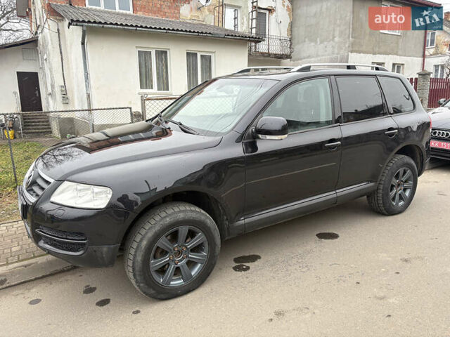 Черный Фольксваген Туарег, объемом двигателя 2.51 л и пробегом 321 тыс. км за 5999 $, фото 1 на Automoto.ua