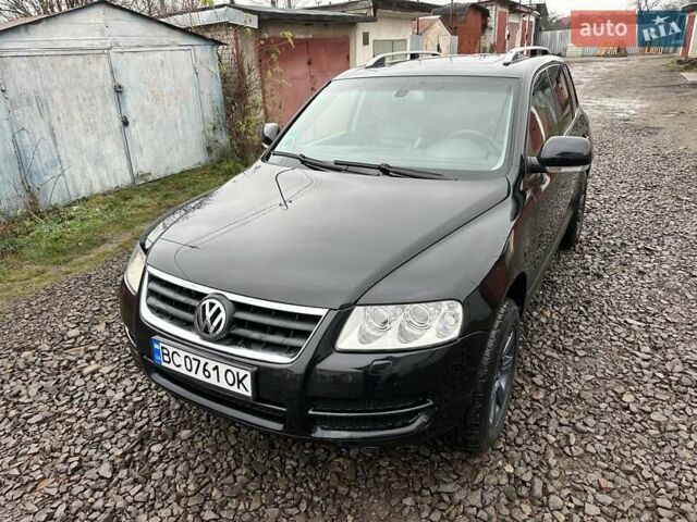 Черный Фольксваген Туарег, объемом двигателя 2.46 л и пробегом 225 тыс. км за 6450 $, фото 1 на Automoto.ua