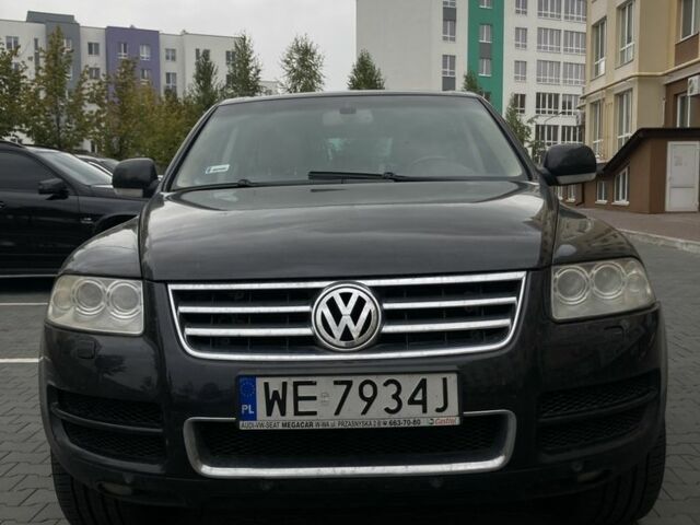 Черный Фольксваген Туарег, объемом двигателя 5 л и пробегом 225 тыс. км за 4099 $, фото 1 на Automoto.ua