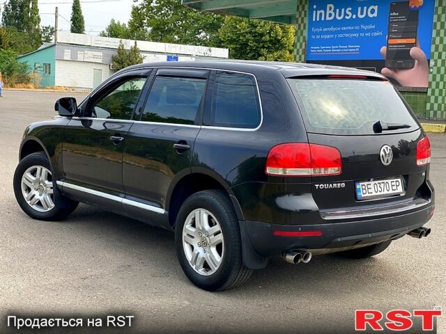 Черный Фольксваген Туарег, объемом двигателя 3.2 л и пробегом 243 тыс. км за 8500 $, фото 2 на Automoto.ua