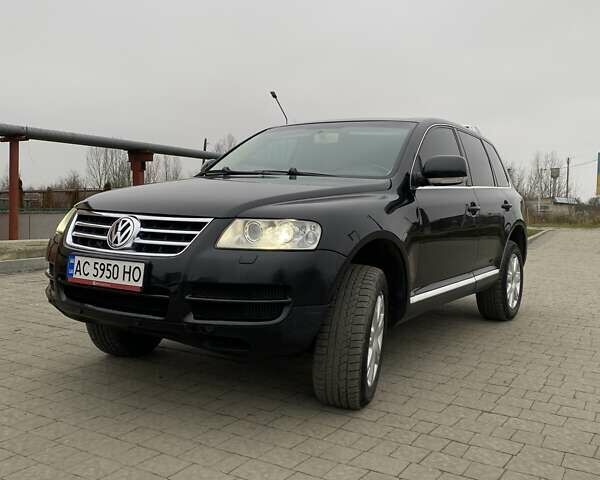 Черный Фольксваген Туарег, объемом двигателя 2.97 л и пробегом 390 тыс. км за 8700 $, фото 1 на Automoto.ua