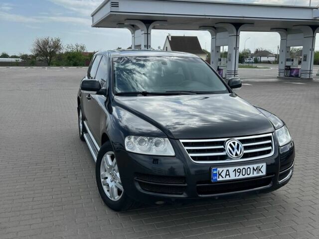 Черный Фольксваген Туарег, объемом двигателя 4.2 л и пробегом 318 тыс. км за 6500 $, фото 1 на Automoto.ua