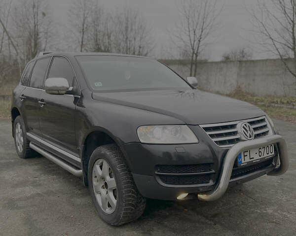 Черный Фольксваген Туарег, объемом двигателя 3 л и пробегом 325 тыс. км за 5900 $, фото 4 на Automoto.ua