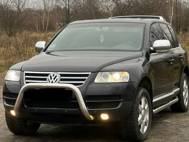 Чорний Фольксваген Туарег, об'ємом двигуна 3 л та пробігом 325 тис. км за 5999 $, фото 2 на Automoto.ua