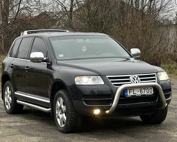 Черный Фольксваген Туарег, объемом двигателя 3 л и пробегом 325 тыс. км за 5900 $, фото 1 на Automoto.ua