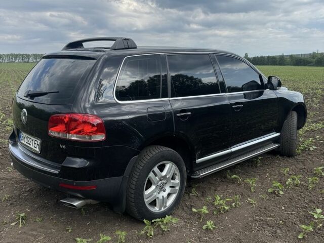 Черный Фольксваген Туарег, объемом двигателя 3.2 л и пробегом 290 тыс. км за 7700 $, фото 2 на Automoto.ua