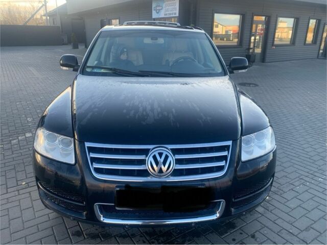 Чорний Фольксваген Туарег, об'ємом двигуна 5 л та пробігом 370 тис. км за 4200 $, фото 1 на Automoto.ua