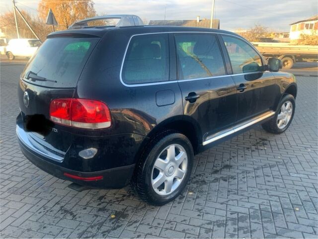 Чорний Фольксваген Туарег, об'ємом двигуна 5 л та пробігом 370 тис. км за 4200 $, фото 4 на Automoto.ua