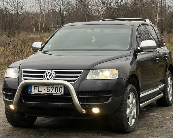 Черный Фольксваген Туарег, объемом двигателя 3 л и пробегом 325 тыс. км за 5900 $, фото 2 на Automoto.ua