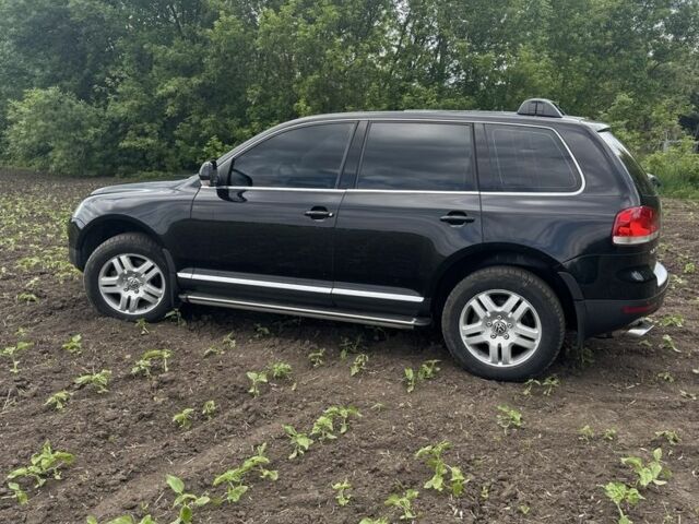 Черный Фольксваген Туарег, объемом двигателя 3.2 л и пробегом 290 тыс. км за 7700 $, фото 1 на Automoto.ua