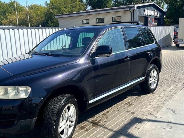 Черный Фольксваген Туарег, объемом двигателя 3 л и пробегом 250 тыс. км за 10700 $, фото 1 на Automoto.ua