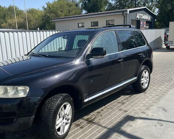 Черный Фольксваген Туарег, объемом двигателя 3 л и пробегом 250 тыс. км за 9700 $, фото 1 на Automoto.ua