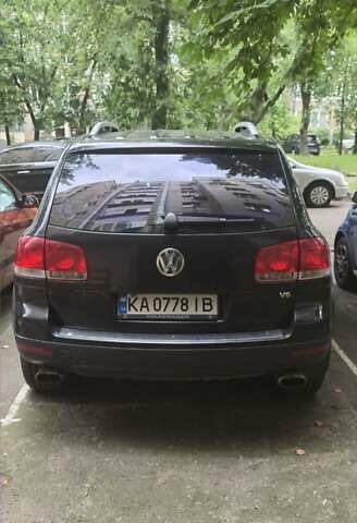 Черный Фольксваген Туарег, объемом двигателя 3.2 л и пробегом 360 тыс. км за 9500 $, фото 1 на Automoto.ua