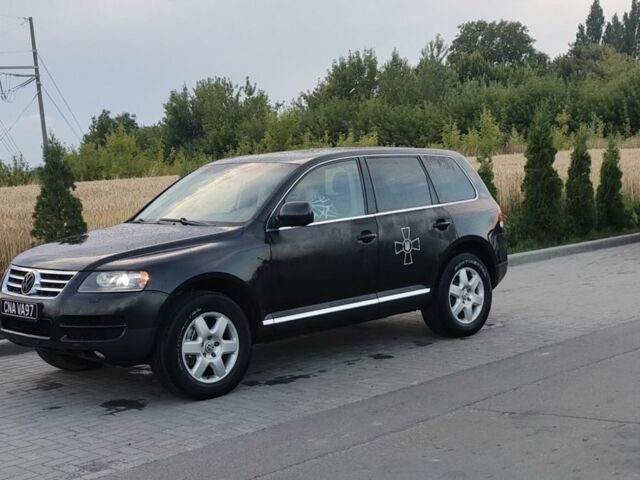 Черный Фольксваген Туарег, объемом двигателя 5 л и пробегом 300 тыс. км за 3000 $, фото 1 на Automoto.ua