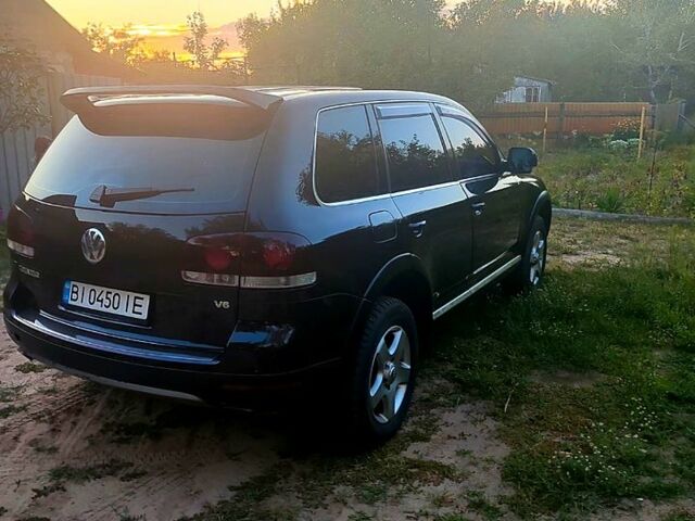 Черный Фольксваген Туарег, объемом двигателя 3.2 л и пробегом 355 тыс. км за 8300 $, фото 1 на Automoto.ua