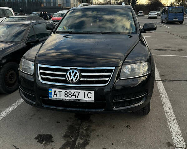 Черный Фольксваген Туарег, объемом двигателя 2.46 л и пробегом 325 тыс. км за 8700 $, фото 2 на Automoto.ua