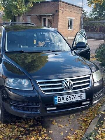 Чорний Фольксваген Туарег, об'ємом двигуна 2.99 л та пробігом 322 тис. км за 10500 $, фото 1 на Automoto.ua