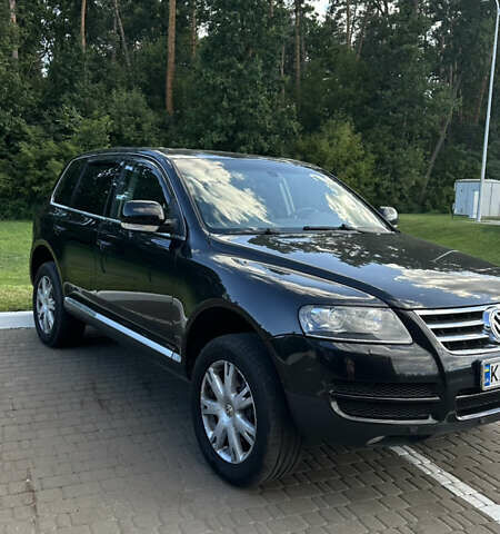 Черный Фольксваген Туарег, объемом двигателя 2.97 л и пробегом 281 тыс. км за 10500 $, фото 1 на Automoto.ua