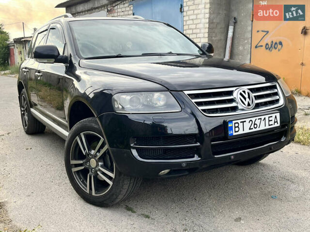 Чорний Фольксваген Туарег, об'ємом двигуна 3 л та пробігом 230 тис. км за 14000 $, фото 1 на Automoto.ua