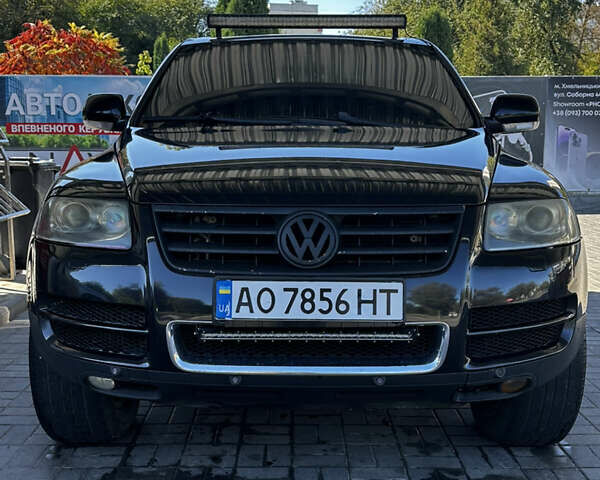 Черный Фольксваген Туарег, объемом двигателя 5 л и пробегом 270 тыс. км за 8750 $, фото 1 на Automoto.ua