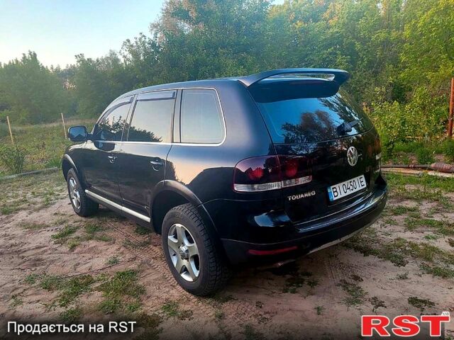 Черный Фольксваген Туарег, объемом двигателя 3.2 л и пробегом 355 тыс. км за 8300 $, фото 2 на Automoto.ua