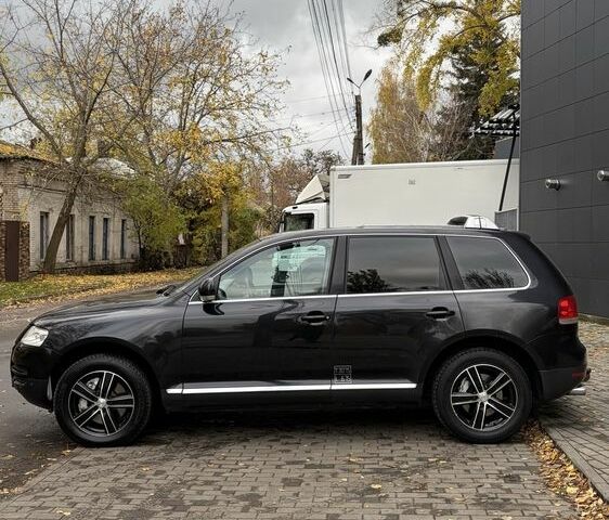 Чорний Фольксваген Туарег, об'ємом двигуна 5 л та пробігом 300 тис. км за 4700 $, фото 6 на Automoto.ua