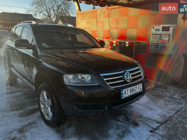 Черный Фольксваген Туарег, объемом двигателя 2.46 л и пробегом 325 тыс. км за 8700 $, фото 1 на Automoto.ua